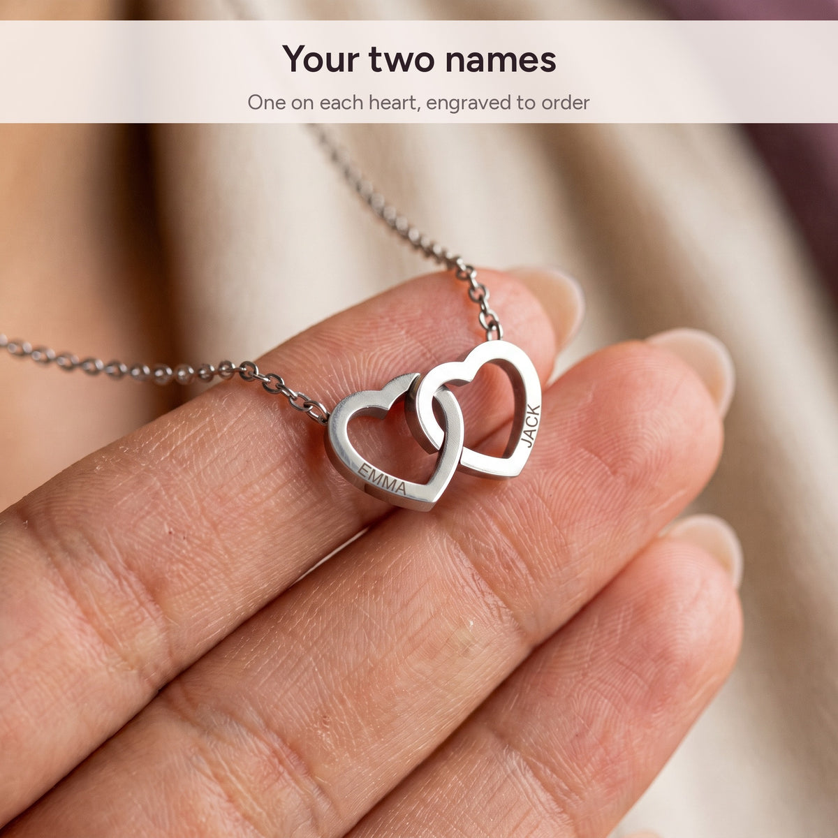 Two names engraved on the interlocking hearts