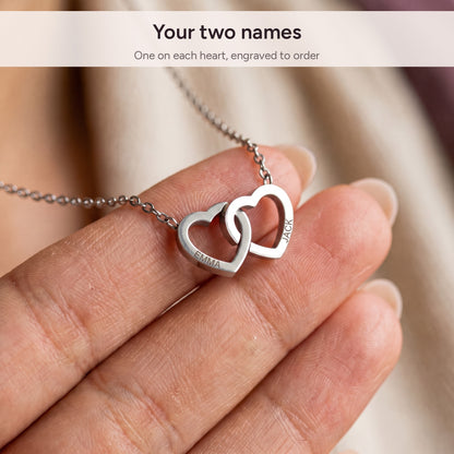 Two names engraved on the interlocking hearts