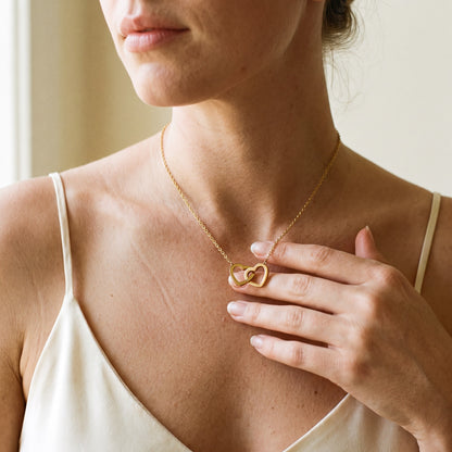 Interlocking hearts necklace worn